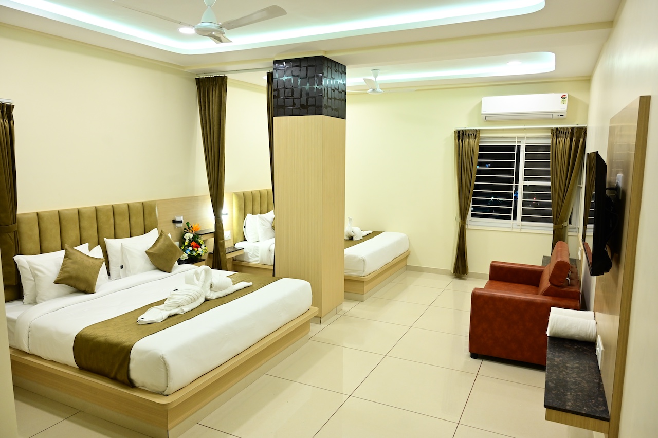 Premium Family Suite room at SR Grand Hotel Tumkur — spacious, air-conditioned with luxury furnishings