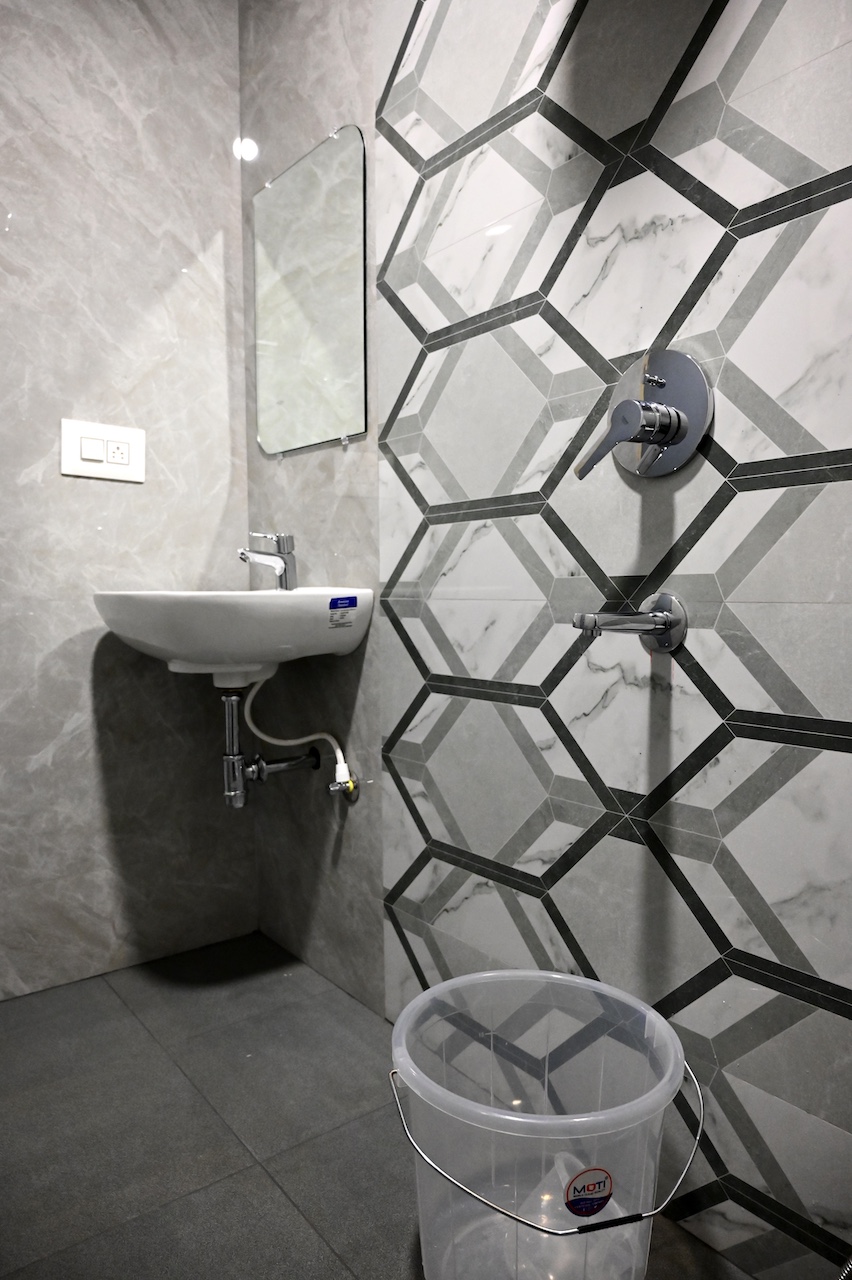 Clean private bathroom at SR Grand Hotel Tumkur — premium fittings and complimentary toiletries
