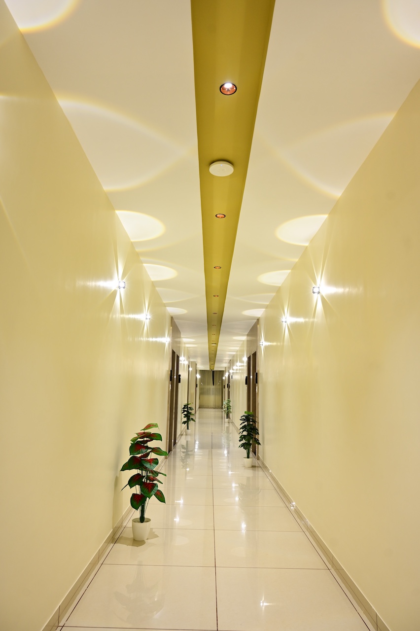 Common area and corridor at SR Grand Hotel Tumkur — well-lit and maintained hotel premises
