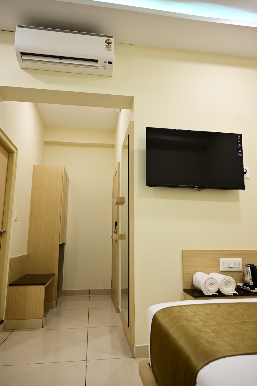 Smart TV with OTT streaming in SR Grand Hotel room, Tumkur — Netflix, Prime and more included